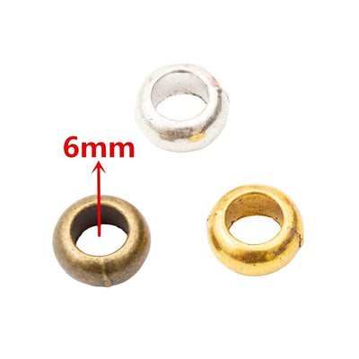 Front view of smooth large-hole spacer bead showing finish variation 1
