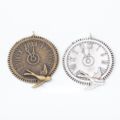 Swallow-decorated round clock face shown across the available finishes