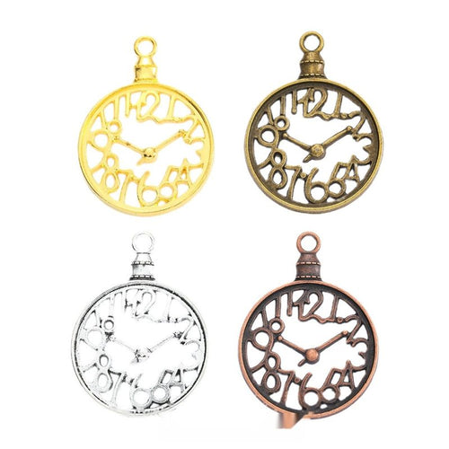 Overview of openwork clock charm pieces on a white background