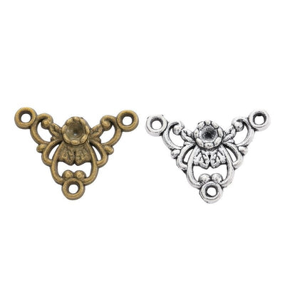 Grouped front views of the floral scroll three loop connector in two antique finishes