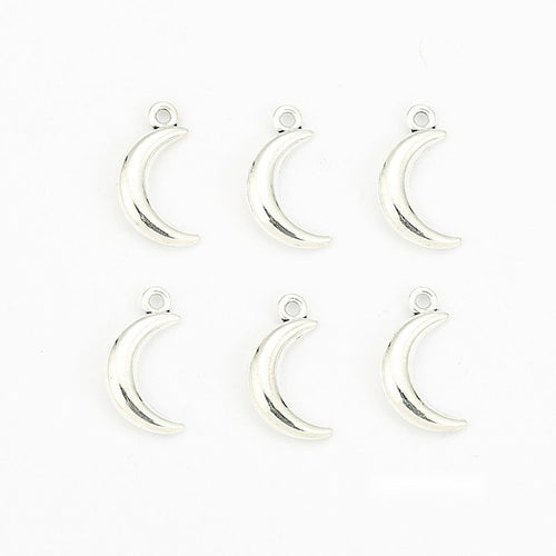 Group view of mini crescent moon charm showing all 1 pictured finish variants