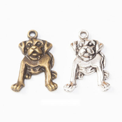Sitting Bulldog Metal Charms in Two Antique Finishes in multiple metallic finishes displayed together on a white backgro