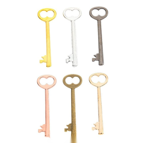 Heart Bow Key Charm Pendant finish comparison showing a heart-shaped bow and a classic long key shaft