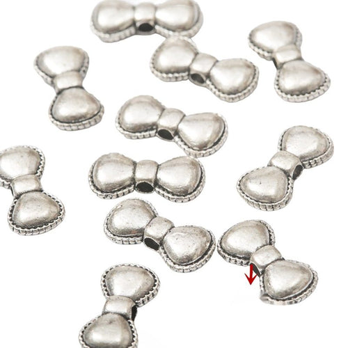 Antique Silver bow spacer bead shown in product image 1