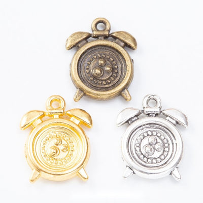 Alarm Clock Round Cabochon Setting Charm shown in the available visible finishes