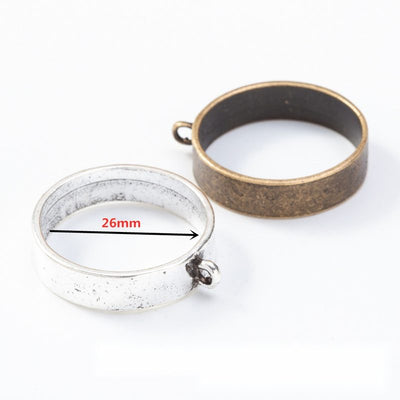 Round Open Back Bezel Pendant Frames in Two Finishes in multiple metallic finishes displayed together on a white backgro