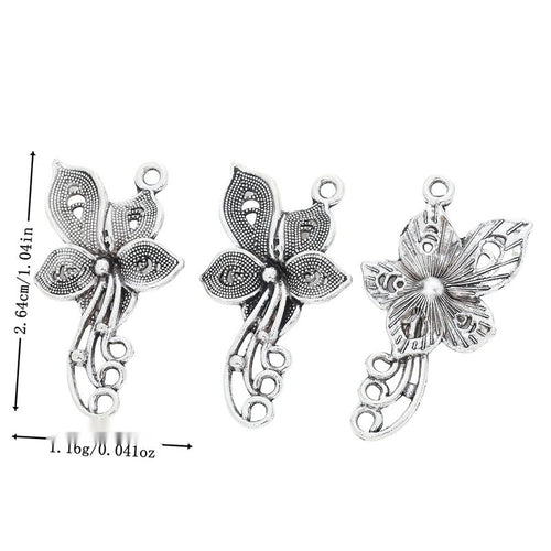 Overview of butterfly flower charm pieces on a white background