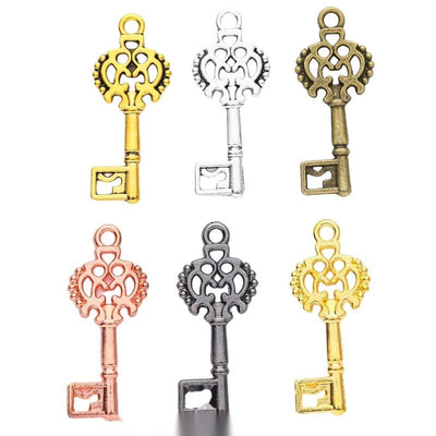 Front comparison of ornate skeleton key metal component in 6 finishes