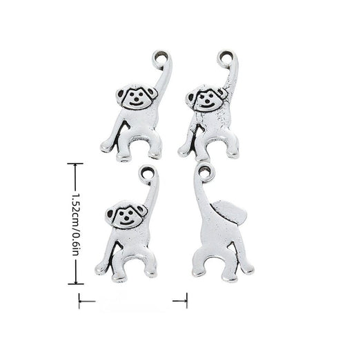 Product image showing the raised arm monkey metal charm and its visible metal details