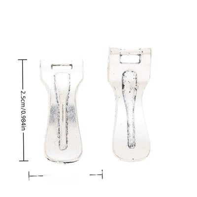 Front and reverse views of vegetable peeler charms with measurement and weight guides