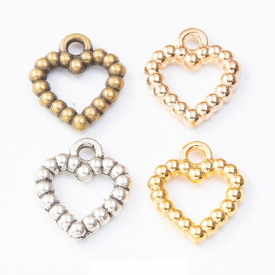 Beaded Open Heart metal pieces shown in the available finishes.