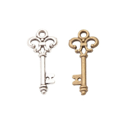 Ornate Skeleton Key Metal Charms in Two Finishes in multiple metallic finishes displayed together on a white background.