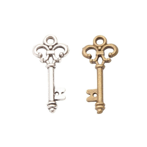Ornate Skeleton Key Metal Charms in Two Finishes in multiple metallic finishes displayed together on a white background.