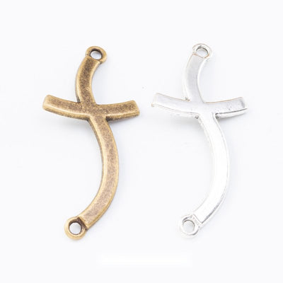 Curved Cross Metal Charm Connectors in Two Finishes in multiple metallic finishes displayed together on a white backgrou