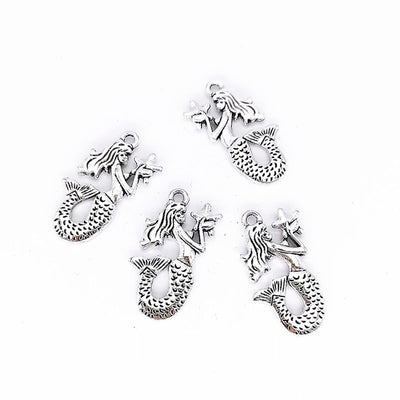 Curled Mermaid metal piece showing overall shape and available finishes