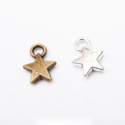 Assorted five point star charms arranged together on a white background