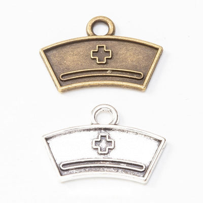 Nurse cap metal component, grouped front view on white
