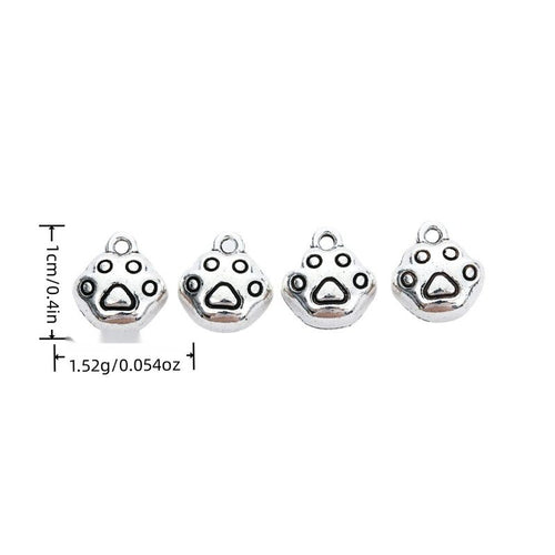 Product image showing the round paw print metal charm and its visible metal details