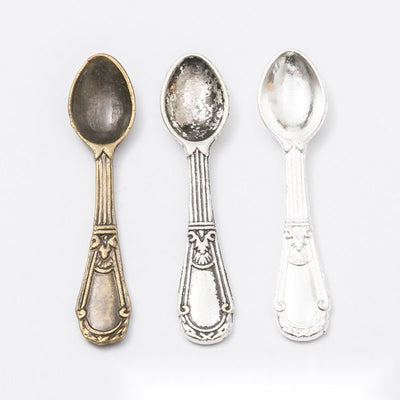 Ornate Teaspoon metal pieces shown in the available finishes.