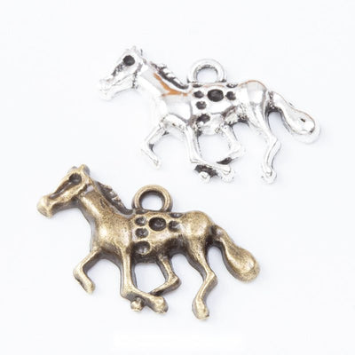 Group view of the running horse charm showing the available finishes and front details
