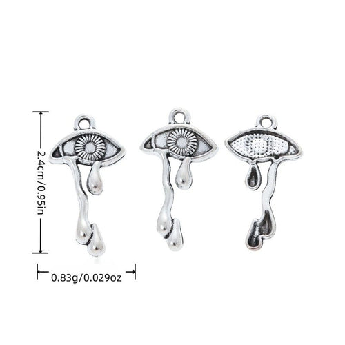 Metal crying eye charm shown in product image 1