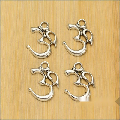 Om Symbol Charm Pendant finish comparison showing an openwork Om symbol silhouette