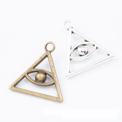 Group view of the triangle eye charm showing the available finishes and front details