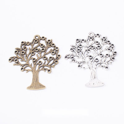 Group view of the tree charm showing the available finishes and front details