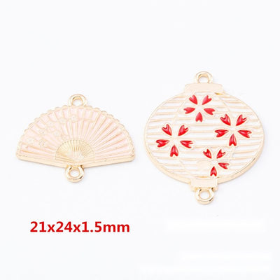 Group view of the fan and lantern connector charm showing the available finishes and front details