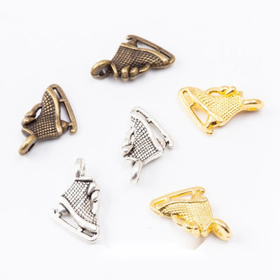 Ice Skate Charm Pendant finish comparison showing a laced skating boot above a curved blade