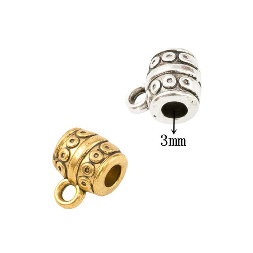 Barrel-shaped large-hole bead with dot motifs and a hanging loop shown in arranged finish comparison