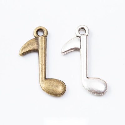 Single Eighth Note Metal Charms in Two Finishes in multiple metallic finishes displayed together on a white background.