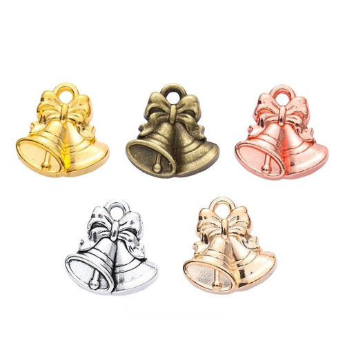Front-facing arrangement of double Christmas bells charms on a white background