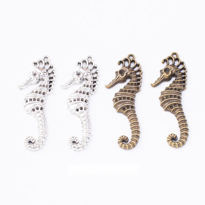Group view of the seahorse charm showing the available finishes and front details