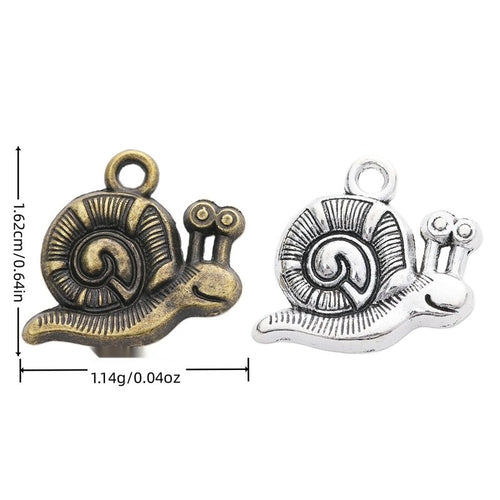 Snail charm with a spiral shell and raised line texture shown in arranged finish comparison