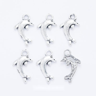 Leaping Dolphin metal piece showing overall shape and available finishes