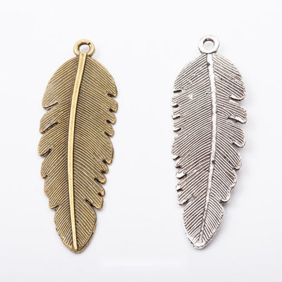 Long Textured Feather metal pieces shown in the available finishes.
