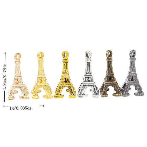 Overview of Eiffel Tower charm pieces on a white background