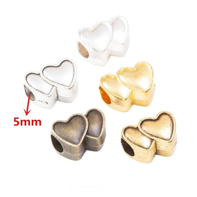 Overview of double heart beads in the available designs and finishes