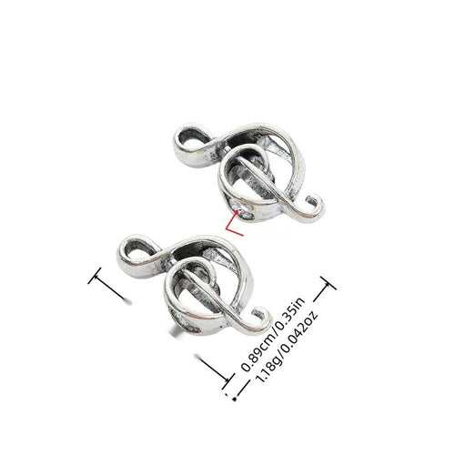 Front view of treble clef large-hole bead showing finish variation 1
