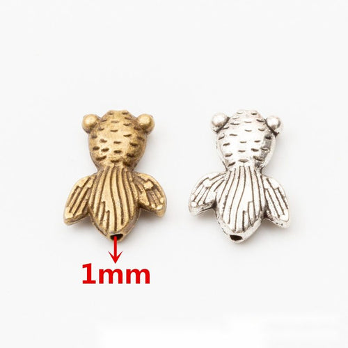 Striped Goldfish Bead metal design group view on a light background