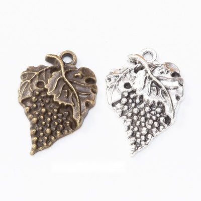 Grape cluster beneath a veined leaf shown in the available finishes