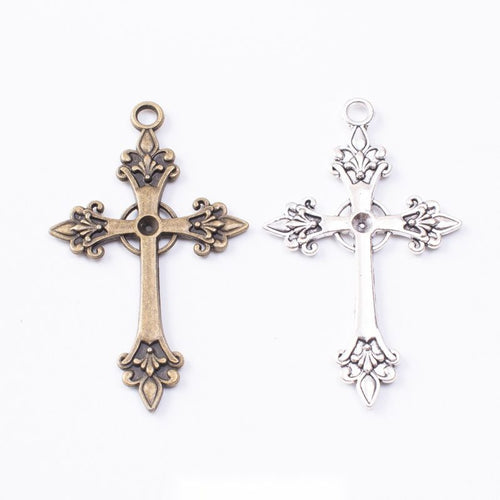 Finish assortment shown together of the ornate fleur cross charm
