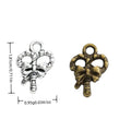 Bow and Candy Cane Charms in Bronze and Antique Silver view 1
