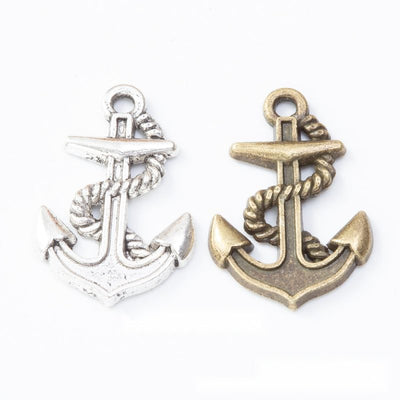 Grouped front views of the rope wrapped anchor metal charm in two antique finishes