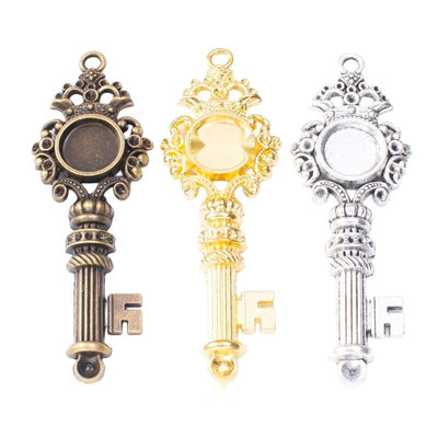 Overview of key-shaped bezel setting pieces on a white background