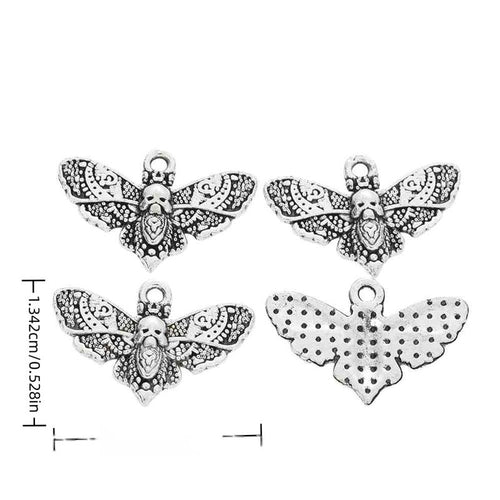 Front and reverse views of moth charms with measurement and weight guides