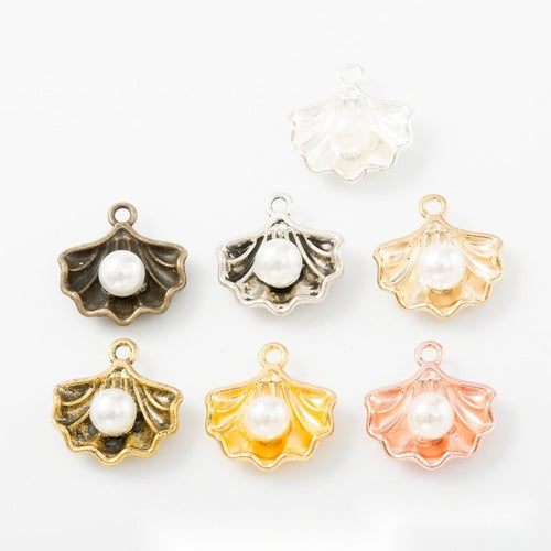 Grouped front view of the shell and white faux pearl metal charm in all pictured styles