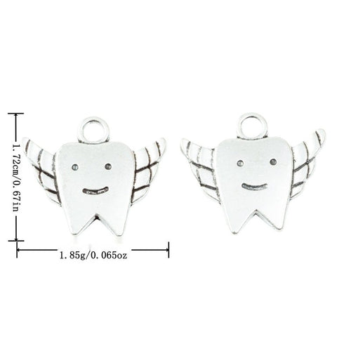 Front and finish comparison of winged tooth charm