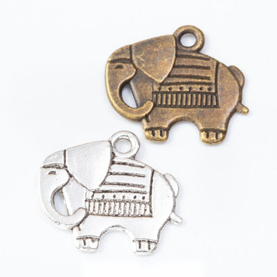 Decorative Elephant Charm Pendant finish comparison showing a patterned blanket and curled trunk